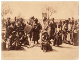 Doyle (John, active India, 1872-1886). A group of Tibetan mummers from Lhasa