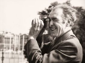 Doisneau (Robert, 1912-1994). Candid portrait of the photographer with his camera