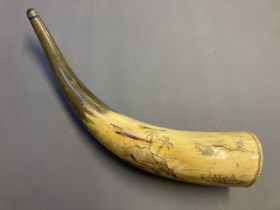 Scrimshaw. A scrimshaw work cow horn, carved with a British three masted ship
