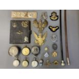 Military Badges. A mixed collection of militaria