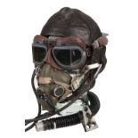 Flying Helmet. WWII period brown leather flying helmet, H type oxygen mask and goggles