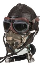 Flying Helmet. WWII period brown leather flying helmet, H type oxygen mask and goggles