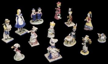 Alice in Wonderland. A group of pottery figurines by Peggy Foy