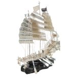 A CHINESE WHITE METAL MODEL OF A THREE MASTED JUNK