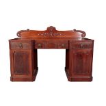 A REGENCY MAHOGANY PEDESTAL SIDEBOARD