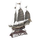 A CHINESE WHITE METAL MODEL OF A THREE MASTED JUNK