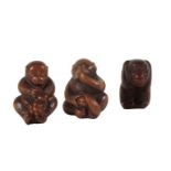 A GROUP OF THREE JAPANESE CARVED WOOD NETSUKE, ONE SIGNED BY YOSHINOBU