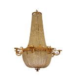 A REGENCY STYLE GILT METAL AND CUT GLASS EIGHT LIGHT CHANDELIER