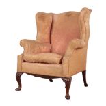 A GEORGE I STYLE MAHOGANY WING ARMCHAIR