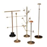 FIVE VICTORIAN BRASS HABERDASHERY STANDS