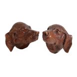 A PAIR OF LATE 19TH CENTURY BLACK FOREST LIMEWOOD WALL CARVINGS OF GUN DOG HEADS