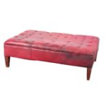 A MOROCCAN RED LEATHER OTTOMAN