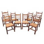 A SET OF EIGHT OAK DINING CHAIRS