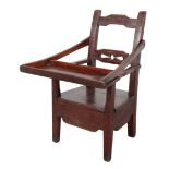 A PROVINCIAL STAINED PINE CHILD'S CHAIR WITH FOLDING TRAY