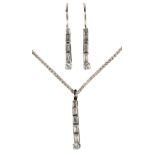 A DIAMOND PENDANT AND EARRINGS SUITE