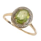A PERIDOT AND DIAMOND CLUSTER RING