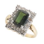 A DARK GREEN TOURMALINE AND DIAMOND CLUSTER RING