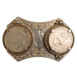 AN UNMARKED WHITE METAL BELT BUCKLE