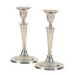 A PAIR OF LATE VICTORIAN SILVER CANDLESTICKS