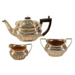 A LATE VICTORIAN SILVER THREE PIECE BACHELORS TEA SERVICE