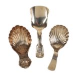 A GEORGE III SILVER SCALLOP BOWL CADDY SPOON