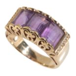 AN AMETHYST THREE STONE DRESS RING