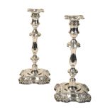A MATCHED PAIR OF EDWARD VII SILVER CANDLESTICKS OF 18TH CENTURY DESIGN