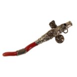 A VICTORIAN CHILD'S WHITE METAL AND CORAL RATTLE/TEETHER