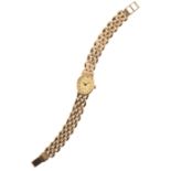 ACCURIST: A 9CT GOLD LADY'S BRACELET WATCH