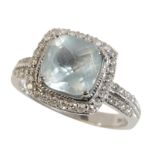 AN AQUAMARINE AND DIAMOND CLUSTER RING