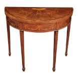 AN EDWARDIAN MAHOGANY AND MARQUETRY DEMI-LUNE CARD TABLE