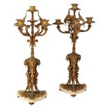 A PAIR OF REGENCY STYLE GILT METAL FIVE LIGHT CANDELABRA