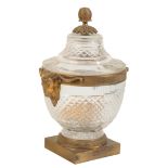 AN EMPIRE CUT GLASS AND GILT METAL MOUNTED CAVIAR URN