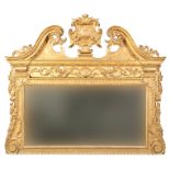 A GEORGE II GILTWOOD OVERMANTLE MIRROR IN THE MANNER OF WILLIAM KENT