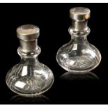 A PAIR OF AUSTRIAN ART NOUVEAU SILVER TOPPED CRYSTAL DRESSING TABLE BOTTLES