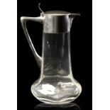 AN EARLY 20TH CENTURY SILVER MOUNTED CRYSTAL CLARET JUG
