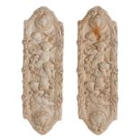 A PAIR OF PLASTER RELIEF CARVED WALL PLAQUES