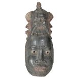 A POLYNESIAN CARVED AND PAINTED WOOD MASK