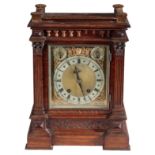 A VICTORIAN OAK MANTEL CLOCK