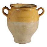 A TERRACOTTA TWIN-HANDLED VASE OR CONFIT JAR