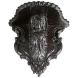 A PAIR OF CONTINENTAL, PROBABLY ITALIAN, CARVED WALNUT WALL BRACKETS
