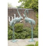 A PAIR OF IMPRESSIVE PAINTED METAL CRANES