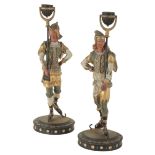 A PAIR OF ITALIAN PAINTED METAL FIGURAL CANDLESTICKS