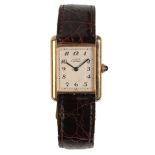 CARTIER (MUST DE CARTIER) : A LADY'S GOLD-PLATED WRISTWATCH