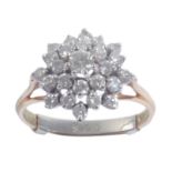 AN 18CT GOLD AND DIAMOND CLUSTER RING