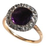 AN AMETHYST AND DIAMOND CLUSTER RING