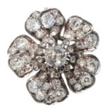 A DIAMOND FLOWER HEAD BROOCH