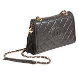 CHANEL: A BLACK LEATHER SHOULDER BAG