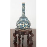 A LATE 19TH CENTURY BLUE AND WHITE POTTERY BOTTLE SHAPED VASE