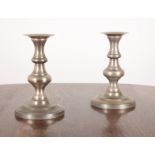 A PAIR OF LARGE PEWTER CANDLESTICKS